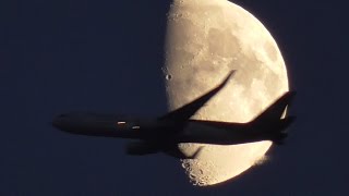 Panasonic HC-V250 Unexpectedly large aircraft flying on a background of Zooming the Moon