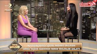 Cansu Taşkın sitting with crossed legs in fishnet stockings
