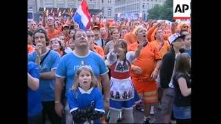 Dutch and Italian fans watch their teams battle it out