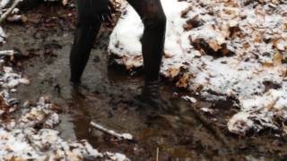 Thigh high latex boots in freezing muddy water