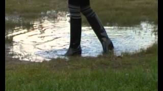 rubber boots in puddle