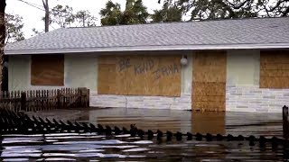 Bonita Springs residents wade home waist-deep in water following Irma