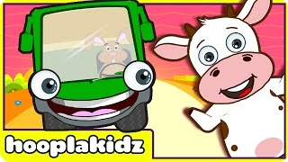 Wheels On The Green Bus Song | HooplaKidz Nursery Rhymes & Kids Songs