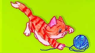 Котенок играет с клубком шерсти