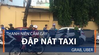 Thanh niên cầm gậy đập nát taxi Grab, Uber | VTC1