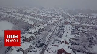 Drone footage captures snowy scenes - BBC News