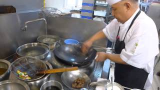 Ngai prepares wagyu beef at Cassia in Singapore