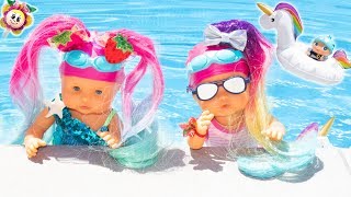 ? Mes bébés assistent à leur premier cours de natation ? avec un beau maillot de bain de sirène ?