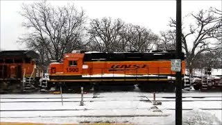 BNSF 6359 with a BNSF GP28M leads a manifest with baretables east in Hinsdale IL