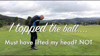 Why do I top the golf ball?  Did I lift my head during golf swing?