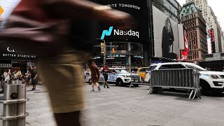 Tech Rally Sends Nasdaq Past 9,000 for First Time