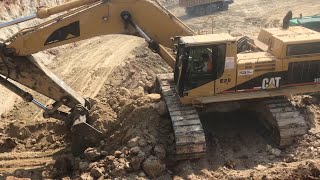 Cat 365B Excavator Loading Trucks
