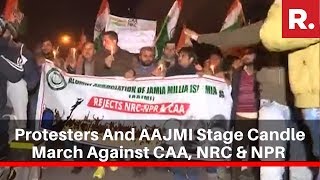 Protesters And Alumni Association Members Of JMU Stage Candle March Against CAA, NRC & NPR In Delhi