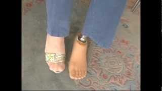 single foot of male amputee dressed with brown and black nylon
