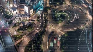 Dubai downtown street with busy traffic and skyscrapers around timelapse.