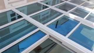 GLASSCON GmbH - RETRACTABLE GLASS ROOF WITH BULLET-PROOF GLASS & EXTERNAL SOLAR SHADES