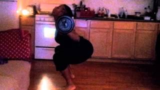 Me squatting with light weight and no shoes