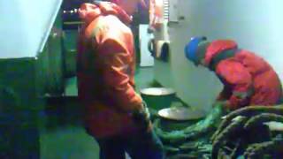 Putting stopper on the stern rope. Vessel # ship # mooring operation