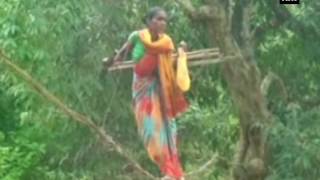 Watch: Villagers make temporary bridge with wires to cross a river - ANI News