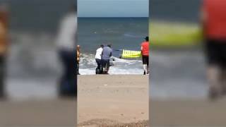 The moment a seal wrapped in netting was rescued on Waxham beach.