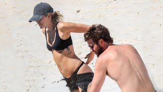 Miley Cyrus and Liam Hemsworth Heat Things Up on the Beach -- See the Pics!