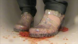 Crushing juicy mini tomatoes in Jelly shoes with glitter New Look