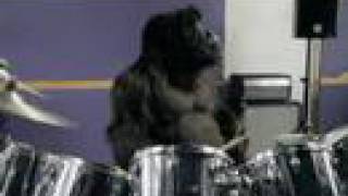 Phil Collins dons his Gorilla suit and plays drums