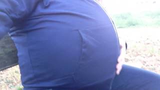 Huge big hard belly sitting and playing