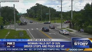 Unidentified limp woman falls out of moving SUV, gets scooped up by driver