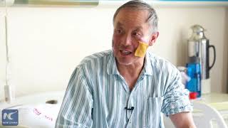 China's 69-year-old double amputee reaches summit of Mount Qomolangma