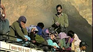 People and bus conductor on top of a bus in Spiti!