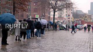 Repurposed Hamburg fish market sees long vaccination queues as country hits 100,000 COVID deaths