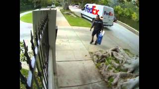 Watch this FedEx Guy Throw Flat Panel TV over the fence