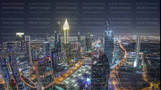 Skyline of the buildings of Sheikh Zayed Road and DIFC aerial night timelapse in Dubai, UAE.