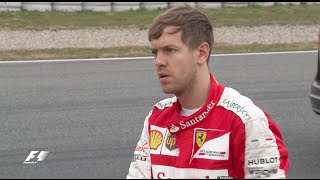 Sebastian Vettel lends a hand after spinning in Barcelona testing