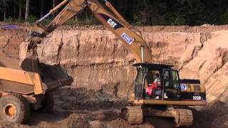 Cat 323D Loading Volvo A25D Dumper With Mud
