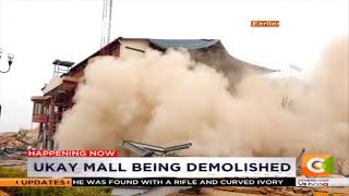 One of the walls falling on the excavator at Ukay Mall,Westlands
