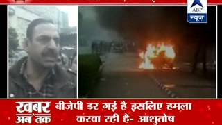 AAP, BJP workers clash in Delhi, vehicle set afire