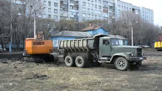 Old soviet excavator EO-5123 n dump truck KrAZ-256B1