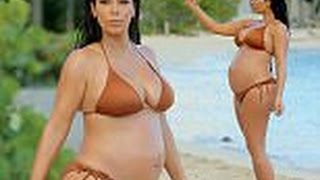 Pregnant Kim Kardashian displays her beautiful baby bump in a bronze string bikini as she snaps self