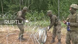Poland: Soldiers install razor wire at Belarus border amid increase in migrant crossings