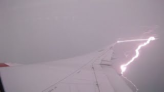 TAKE OFF FROM SKBO AFTER A THUNDERSTORM IN THE AREA, WITH A LIGHTING STRIKE DURING CLIMB