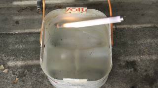 Fluorescent tube in water and smash