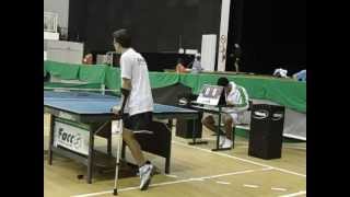 Amputee boy playing table tennis