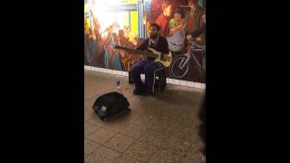Upper extremity amputee playing guitar