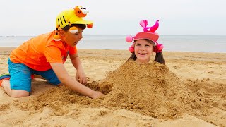 Ali and Adriana have a fun on the beach! Playing with sand toys