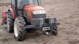 Kioti DK901C tractor with Agrimaster wood winch, front weight from Ferrus Kioti www.ferrus.lv